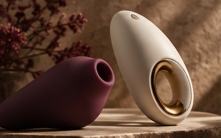 Two intimate wellbeing products on a stone plinth